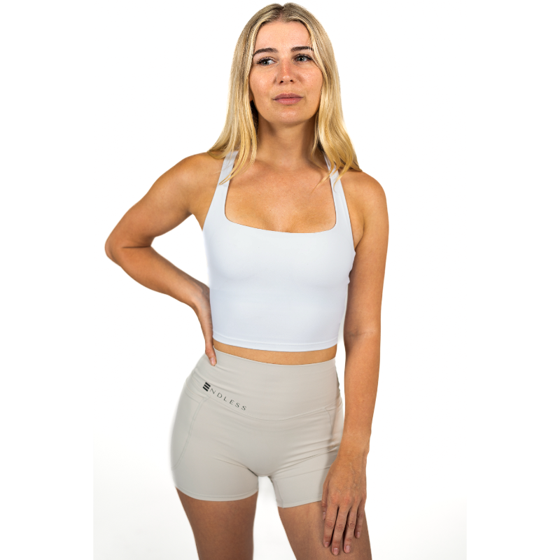 NDLESS-Studio-102_ndlesswaer_womenswear-crosstop-top-workout-top-crosstop-white-top.png